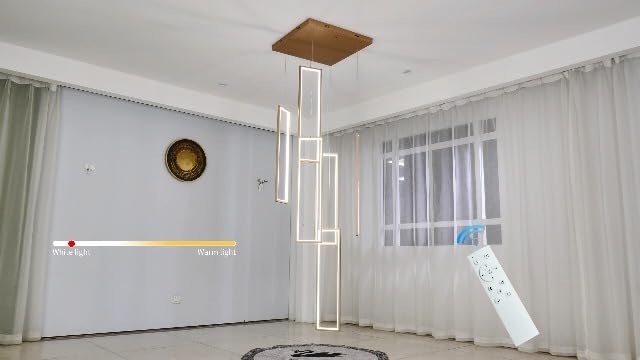 Gold 6-frame rectangular LED chandelier in a modern Australian high-ceiling void