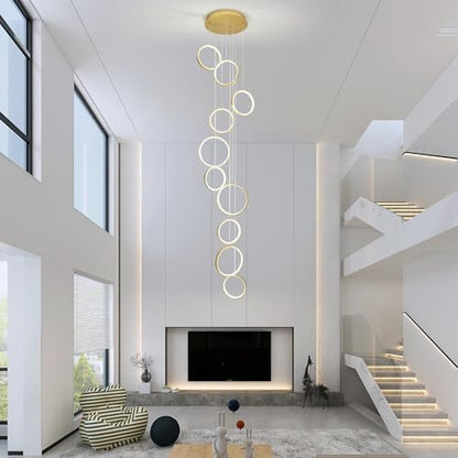 Gold 10-ring spiral LED chandelier in a modern Australian high-ceiling staircase