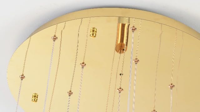 Gold 15-light spiral strip LED chandelier in a modern Australian high-ceiling foyer