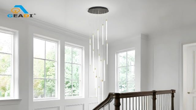 Black 15-light spiral strip LED chandelier in a modern Australian high-ceiling staircase