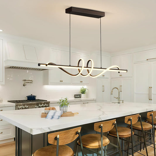 Matte black sculptural ribbon LED pendant light over a marble kitchen island