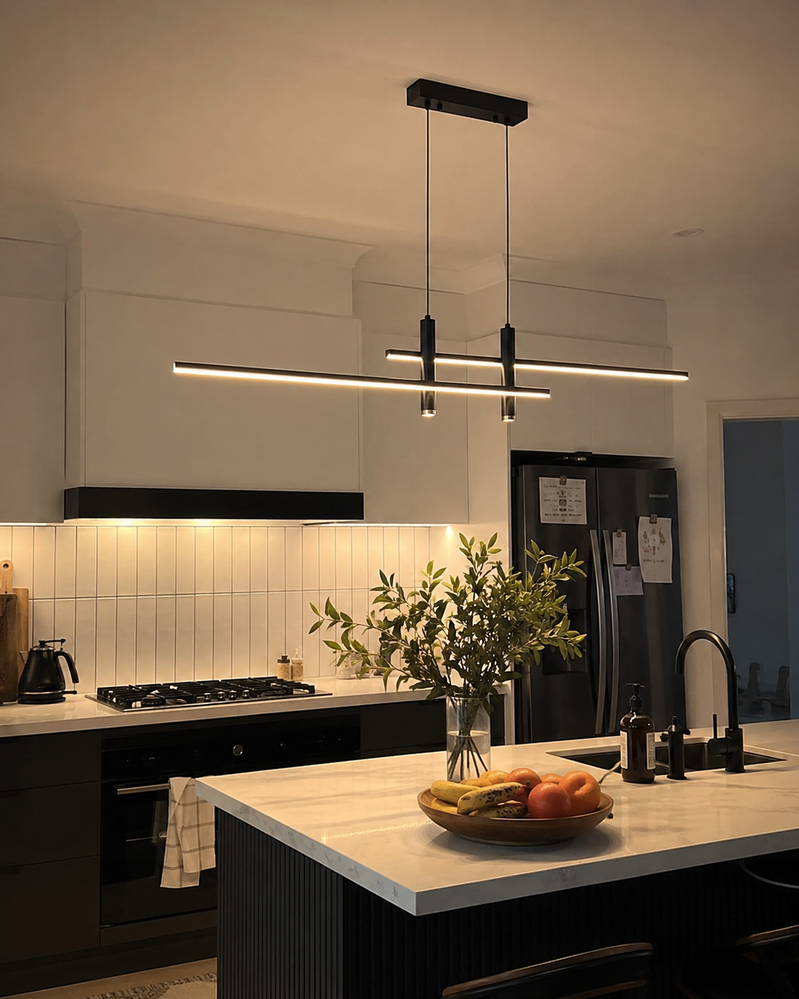 Matte black linear LED pendant light over a marble kitchen island in an Australian home