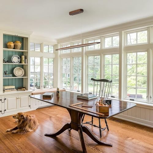 Walnut wood linear LED pendant light over a kitchen island in a modern Australian home
